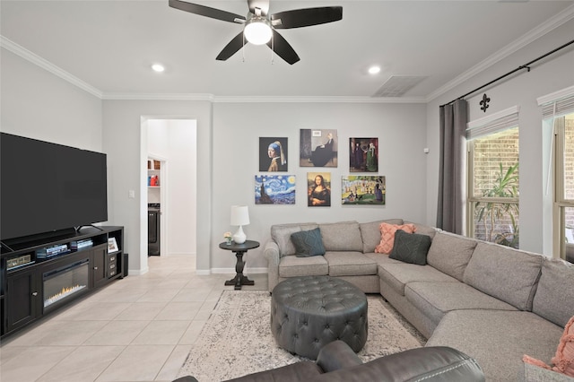 3447 Warwick River Trl, Kingwood, TX 77365 - living room with crown molding, a ceiling fan, light tile patterned flooring, and recessed lighting