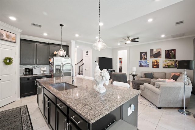 3447 Warwick River Trl, Kingwood, TX 77365 - kitchen featuring stainless steel refrigerator with ice dispenser, crown molding, light tile patterned flooring, ceiling fan, and light stone countertops