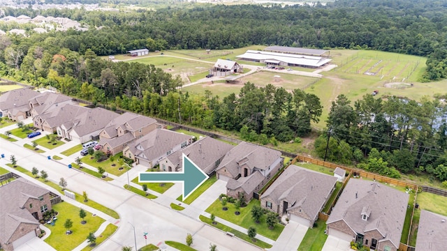 3447 Warwick River Trl, Kingwood, TX 77365 - aerial perspective of suburban area with a heavily wooded area