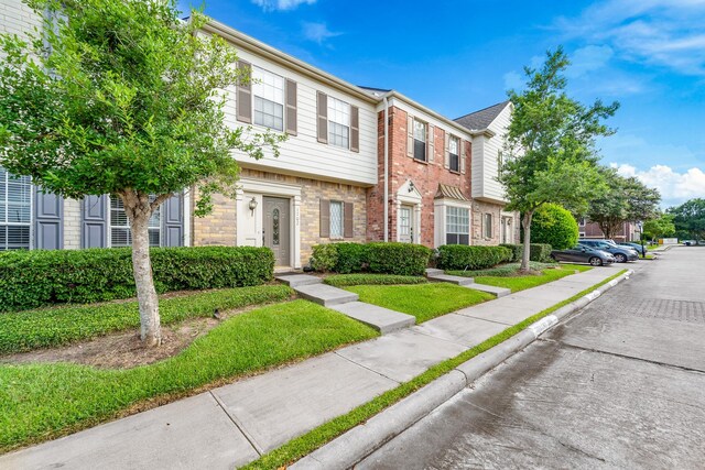 2910 Grants Lake Blvd Unit 1702, Sugar Land, TX 77479 - view of property featuring brick siding