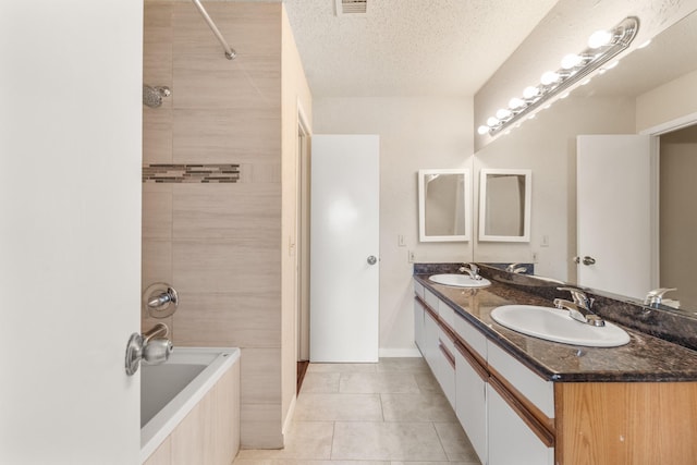 2910 Grants Lake Blvd Unit 1702, Sugar Land, TX 77479 - full bath featuring double vanity, tile patterned flooring, shower / tub combination, and a textured ceiling