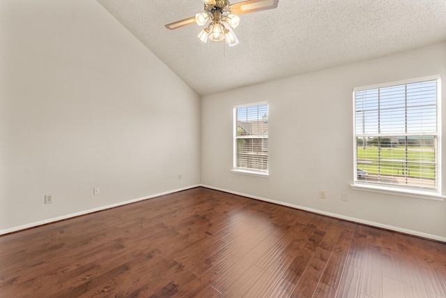 2910 Grants Lake Blvd Unit 1702, Sugar Land, TX 77479 - empty room featuring a ceiling fan, lofted ceiling, dark wood-style flooring, and a textured ceiling