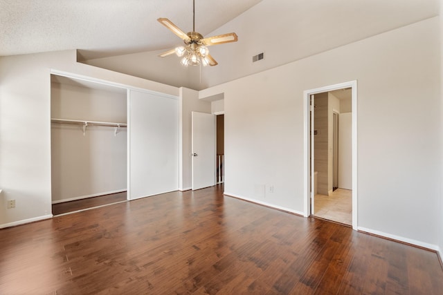 2910 Grants Lake Blvd Unit 1702, Sugar Land, TX 77479 - unfurnished bedroom featuring a closet, lofted ceiling, wood finished floors, and a ceiling fan