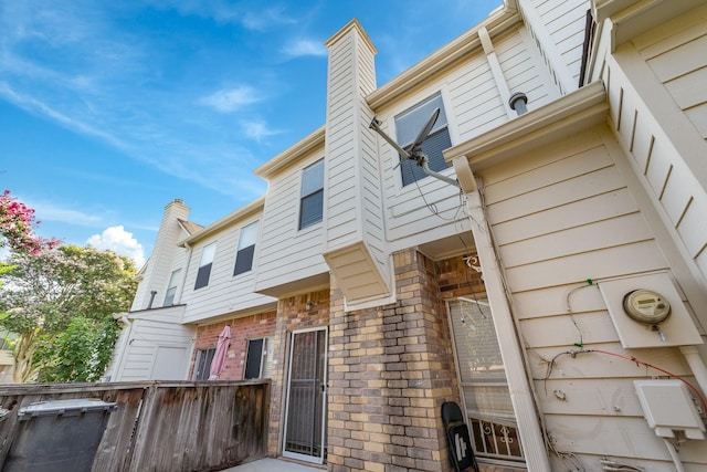 2910 Grants Lake Blvd Unit 1702, Sugar Land, TX 77479 - view of side of property featuring a chimney