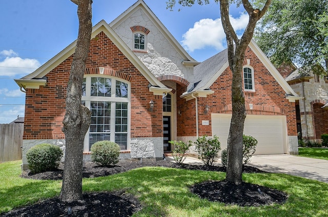 3910 Jade Cove Ln, Sugar Land, TX 77479 - view of front of home with stone siding, concrete driveway, and brick siding