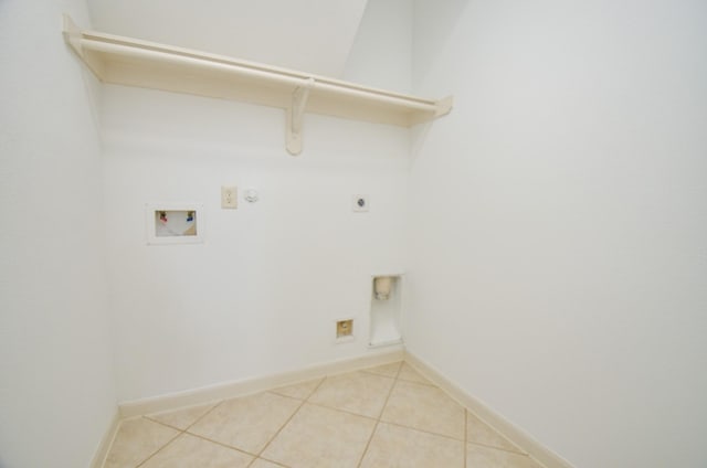 3910 Jade Cove Ln, Sugar Land, TX 77479 - laundry area with electric dryer hookup, washer hookup, light tile patterned flooring, and gas dryer hookup
