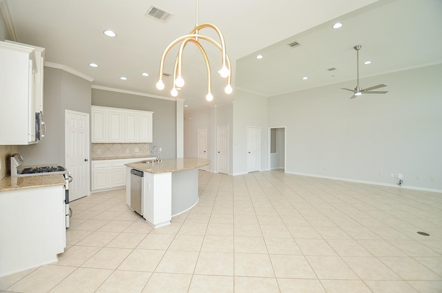 3910 Jade Cove Ln, Sugar Land, TX 77479 - kitchen with stainless steel appliances, open floor plan, crown molding, decorative backsplash, and recessed lighting