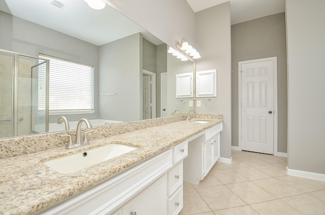 3910 Jade Cove Ln, Sugar Land, TX 77479 - bathroom featuring double vanity, tile patterned flooring, and a stall shower