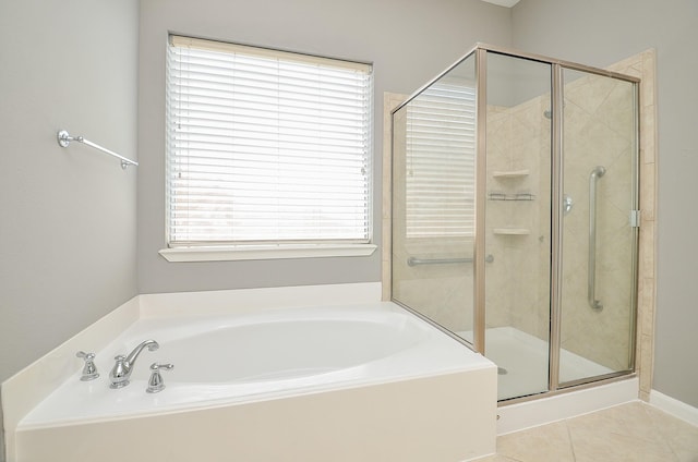 3910 Jade Cove Ln, Sugar Land, TX 77479 - bathroom featuring a garden tub, a stall shower, and tile patterned flooring