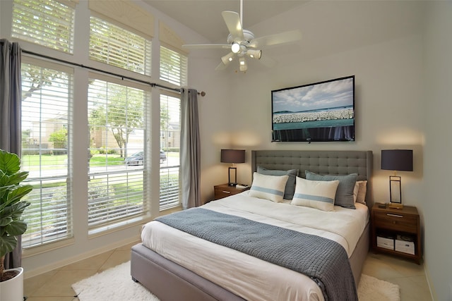 3910 Jade Cove Ln, Sugar Land, TX 77479 - bedroom featuring light tile patterned flooring, a high ceiling, and a ceiling fan
