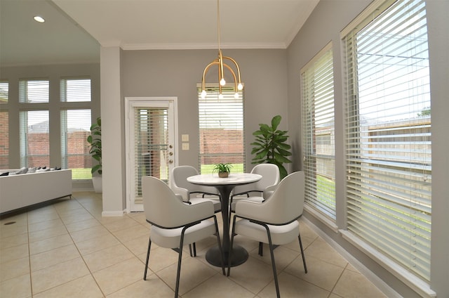 3910 Jade Cove Ln, Sugar Land, TX 77479 - dining room with light tile patterned floors, ornamental molding, and a chandelier