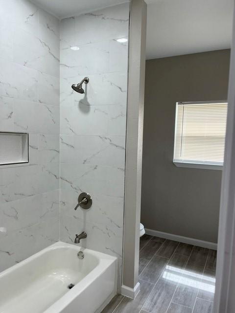 1012 Rd 5606, Cleveland, TX 77327 - bathroom featuring shower / bathtub combination and wood tiled floors
