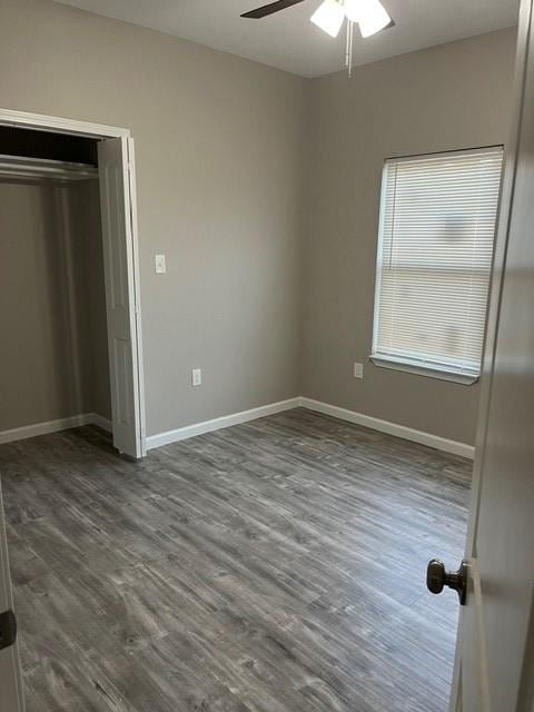 1012 Rd 5606, Cleveland, TX 77327 - unfurnished bedroom featuring wood finished floors, ceiling fan, and a closet