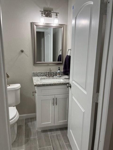 1012 Rd 5606, Cleveland, TX 77327 - half bath featuring vanity and wood finish floors