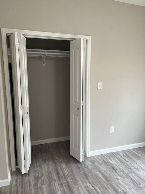 1012 Rd 5606, Cleveland, TX 77327 - unfurnished bedroom with a closet and wood finished floors
