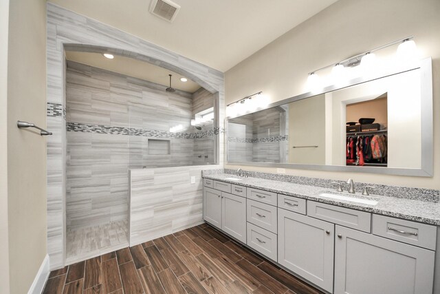 31201 Redwood Manor Ct, Spring, TX 77386 - full bathroom with walk in shower, double vanity, a spacious closet, wood tiled floors, and recessed lighting