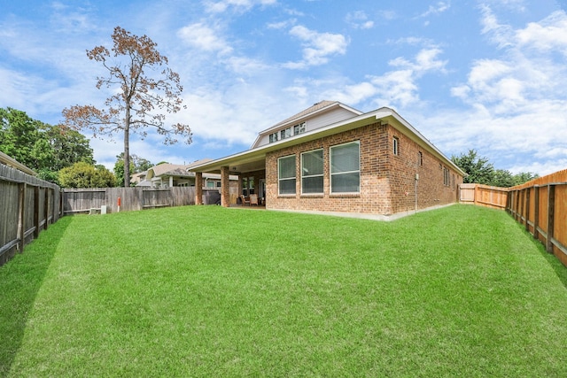 31201 Redwood Manor Ct, Spring, TX 77386 - back of property featuring brick siding and a fenced backyard