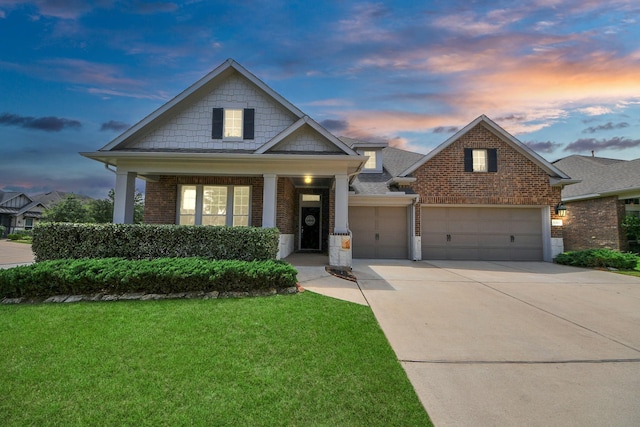 31201 Redwood Manor Ct, Spring, TX 77386 - craftsman-style home featuring brick siding, a front yard, an attached garage, and concrete driveway
