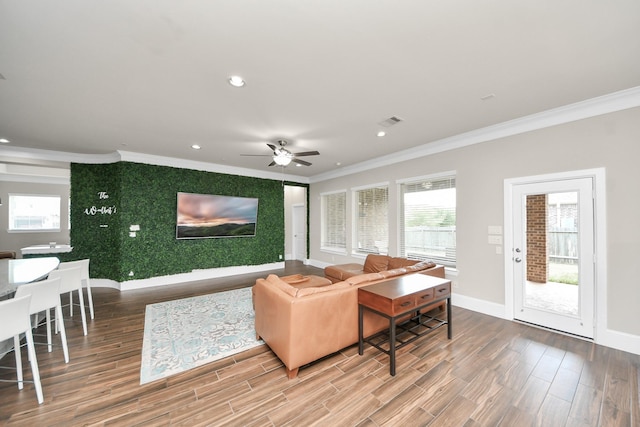 31201 Redwood Manor Ct, Spring, TX 77386 - living area featuring crown molding, wood finished floors, a ceiling fan, recessed lighting, and an accent wall