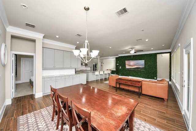 31201 Redwood Manor Ct, Spring, TX 77386 - dining room with ornamental molding, wood finish floors, a chandelier, a ceiling fan, and recessed lighting