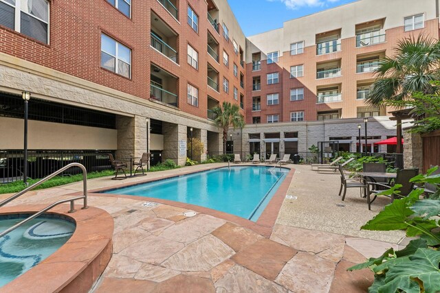 300 St Joseph Pkwy Unit 319, Houston, TX 77002 - community pool with a patio area