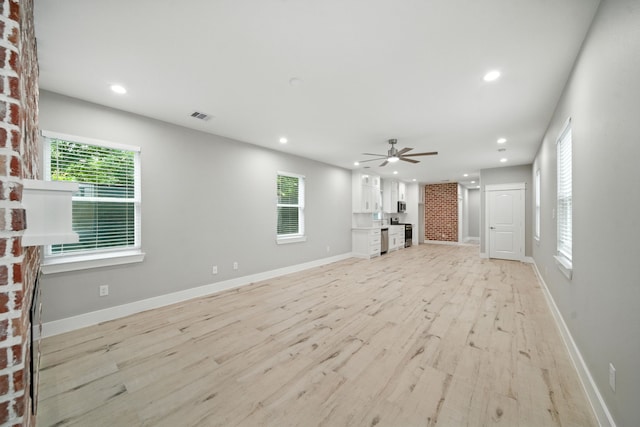 335 Todd St, Tomball, TX 77375 - unfurnished living room with a ceiling fan, light wood-style flooring, and recessed lighting