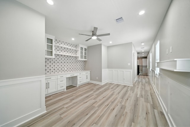 335 Todd St, Tomball, TX 77375 - unfurnished living room featuring ceiling fan, light wood-type flooring, recessed lighting, wainscoting, and a decorative wall