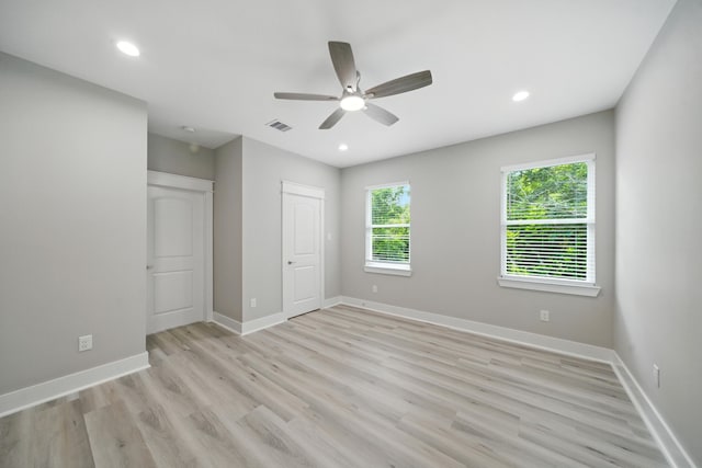 335 Todd St, Tomball, TX 77375 - unfurnished bedroom featuring light wood-style floors, recessed lighting, a ceiling fan, and a closet