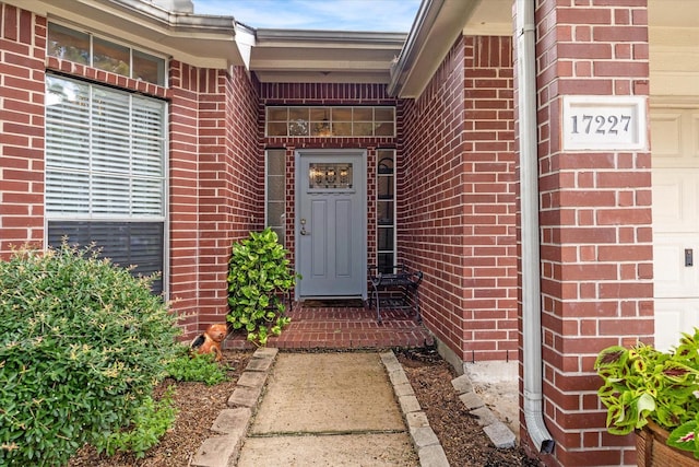 17227 Horsetooth Canyon Dr, Houston, TX 77095 - doorway to property featuring brick siding and a garage