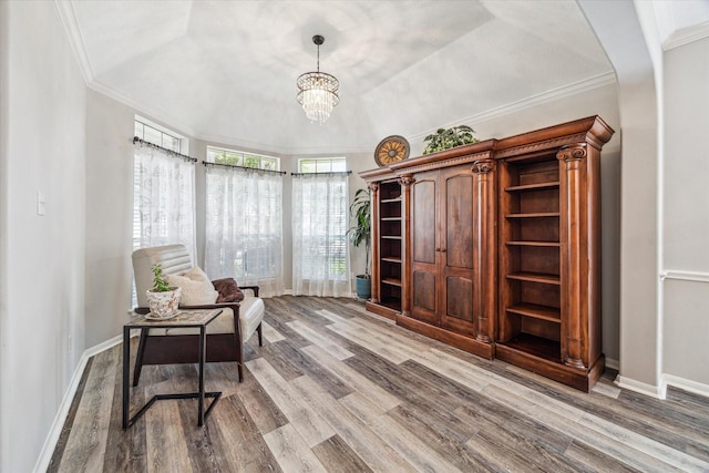 17227 Horsetooth Canyon Dr, Houston, TX 77095 - sitting room featuring wood finished floors, a chandelier, and ornamental molding