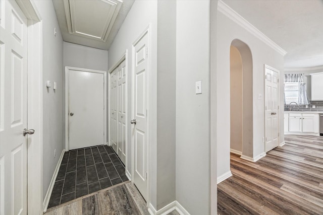 17227 Horsetooth Canyon Dr, Houston, TX 77095 - hall featuring attic access, wood finished floors, arched walkways, and crown molding