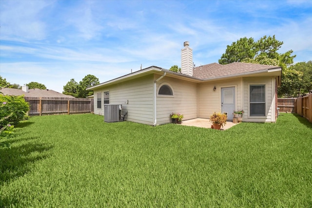 17227 Horsetooth Canyon Dr, Houston, TX 77095 - back of property featuring a fenced backyard, a chimney, and a patio area