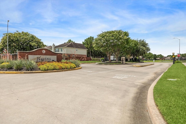 17227 Horsetooth Canyon Dr, Houston, TX 77095 - view of concrete street featuring street lighting, curbs, and traffic signs
