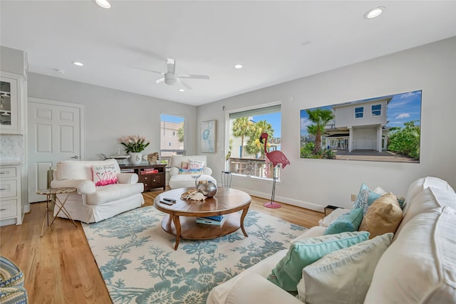 1303 Outrigger, Tiki Island, TX 77554 - living room featuring a ceiling fan, light wood-style flooring, and recessed lighting