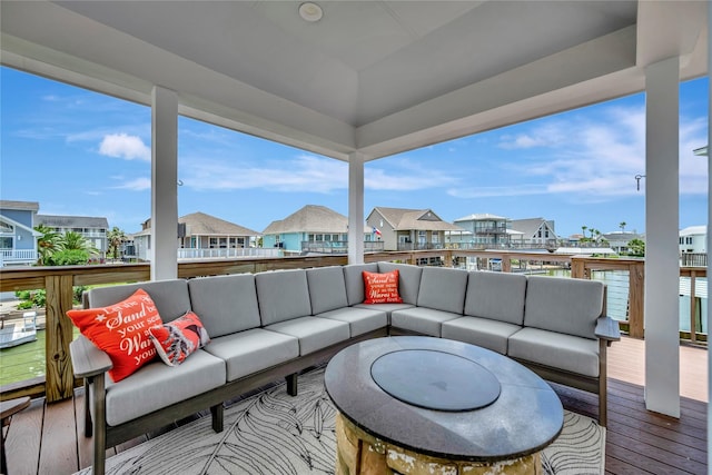 1303 Outrigger, Tiki Island, TX 77554 - wooden deck featuring an outdoor hangout area and a residential view
