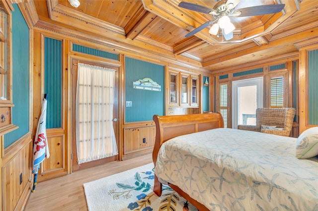 1303 Outrigger, Tiki Island, TX 77554 - bedroom with a wood ceiling with exposed beams, crown molding, wood walls, coffered ceiling, and light wood-type flooring