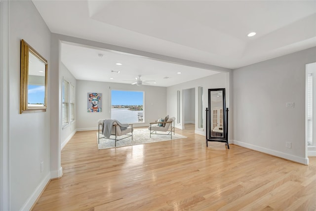 1303 Outrigger, Tiki Island, TX 77554 - living room with light wood-type flooring, ceiling fan, and recessed lighting