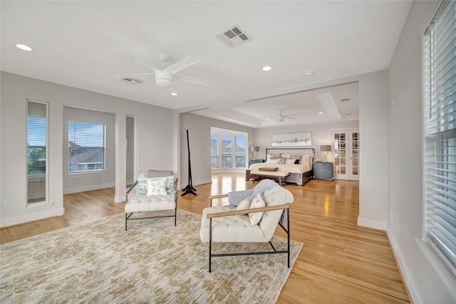 1303 Outrigger, Tiki Island, TX 77554 - living area with a ceiling fan, a raised ceiling, healthy amount of natural light, and recessed lighting
