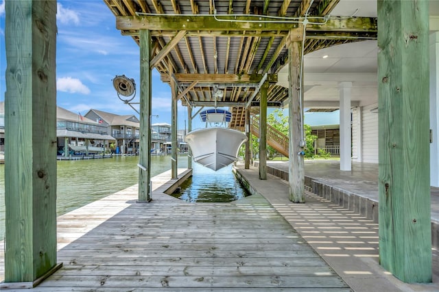 1303 Outrigger, Tiki Island, TX 77554 - dock with boat lift and a water view