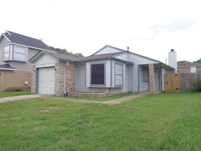 16702 Vista Oak Dr, Houston, TX 77073 - view of front facade with concrete driveway, an attached garage, and brick siding