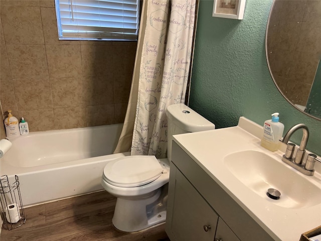 8823 Shadow Crest St, Houston, TX 77074 - bathroom featuring a textured wall, wood finished floors, vanity, and shower / bath combination with curtain