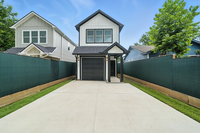 337 Todd St, Tomball, TX 77375 - view of front of home with driveway, a garage, roof with shingles, and board and batten siding