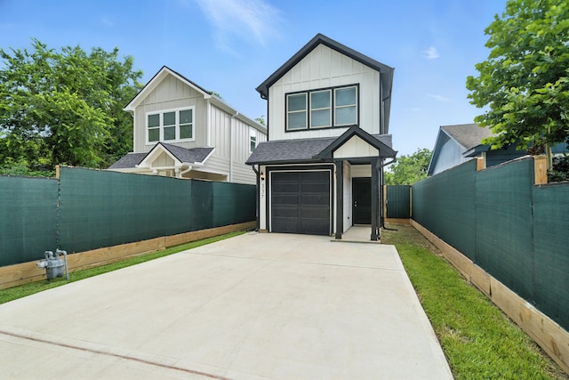 337 Todd St, Tomball, TX 77375 - contemporary house featuring driveway, board and batten siding, and a garage
