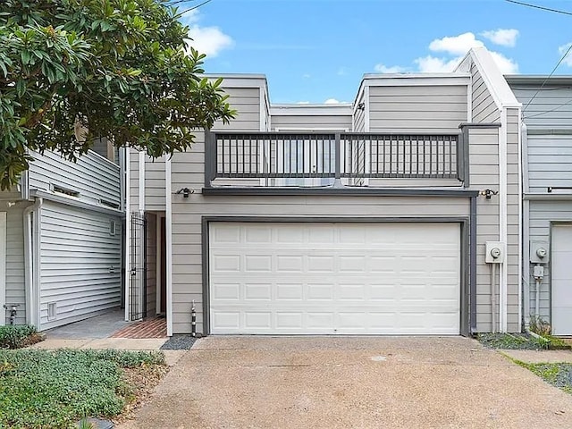3406 Yoakum Blvd, Houston, TX 77006 - view of front of property with a balcony, concrete driveway, and an attached garage