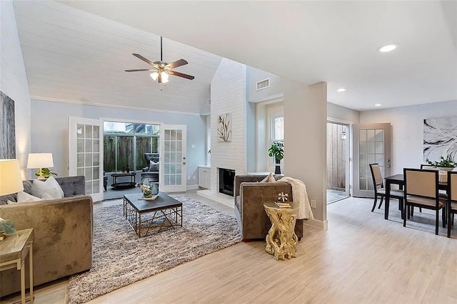 3406 Yoakum Blvd, Houston, TX 77006 - living area with a ceiling fan, light wood-style flooring, a large fireplace, recessed lighting, and lofted ceiling