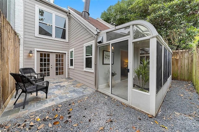 3406 Yoakum Blvd, Houston, TX 77006 - rear view of house with french doors, a fenced backyard, a patio, and a sunroom