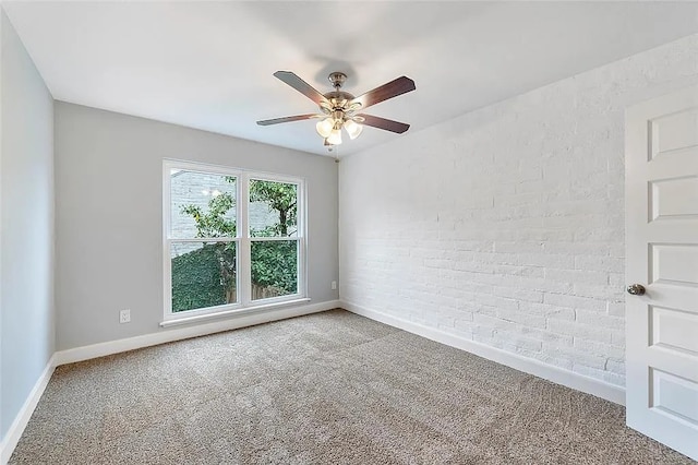 3406 Yoakum Blvd, Houston, TX 77006 - carpeted empty room with a ceiling fan and brick wall