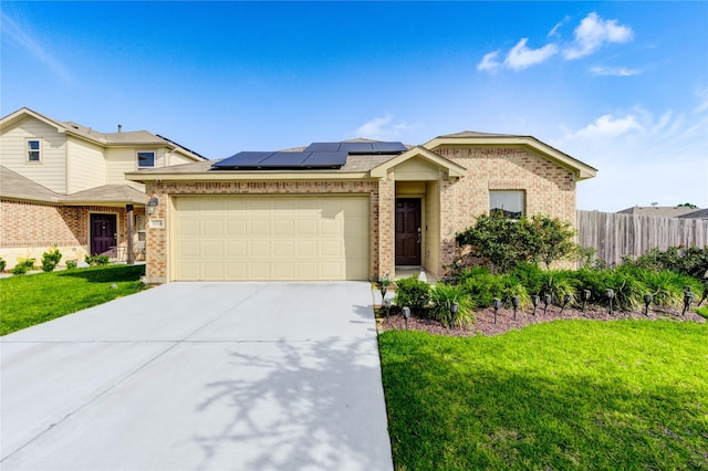 4338 Tulip Oak Dr, Houston, TX 77068 - view of front of home featuring brick siding, a garage, concrete driveway, and solar panels