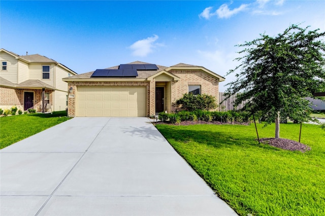 4338 Tulip Oak Dr, Houston, TX 77068 - view of front of home with brick siding, an attached garage, solar panels, concrete driveway, and a front lawn