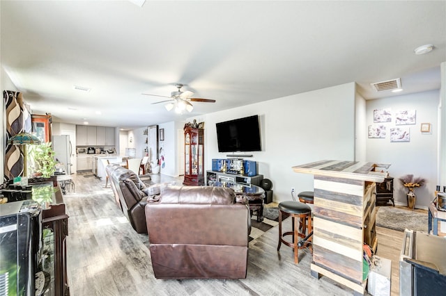 4338 Tulip Oak Dr, Houston, TX 77068 - living area featuring light wood finished floors and a ceiling fan
